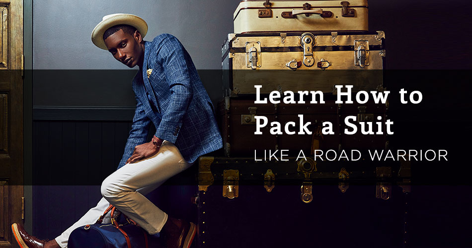 man wearing blue blazers and white pants leaning against suitcases with text overlay "learn how to pack a suit like a road warrior'