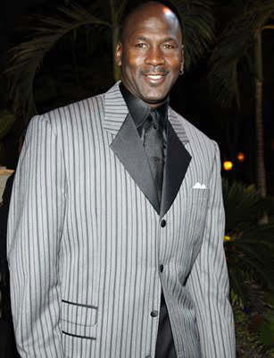 michael jordan wearing a silver pinstripe 4 button suit