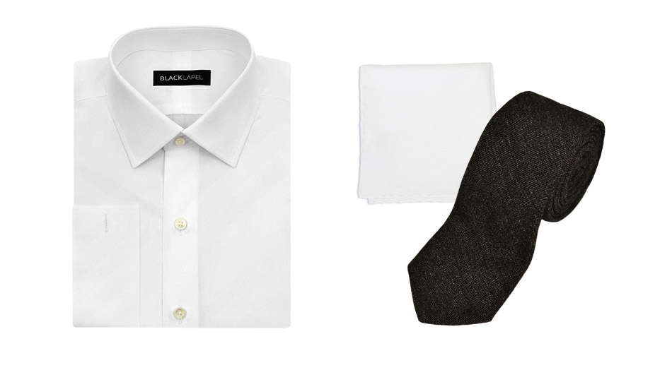 white folded dress shirt presented with a white folded pocket square and black knitted tie