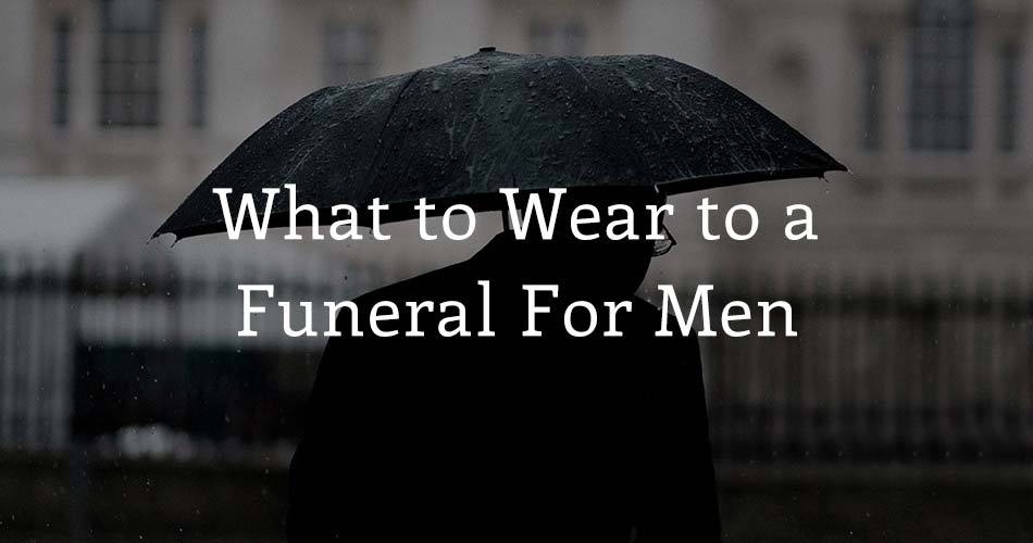 man with black umbrella with text overlay "what to wear to a funeral for men"