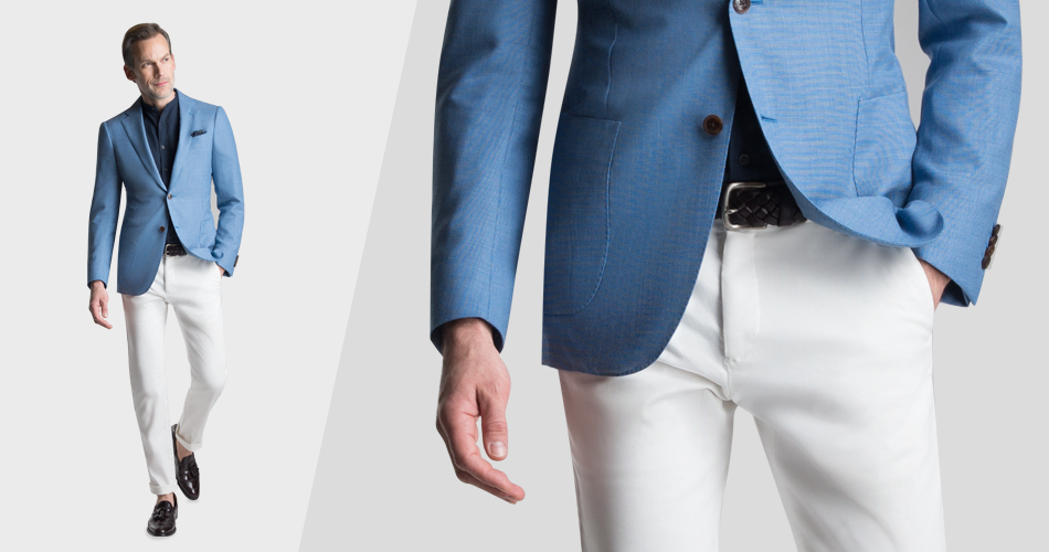 man wearing white pants and blue blazer