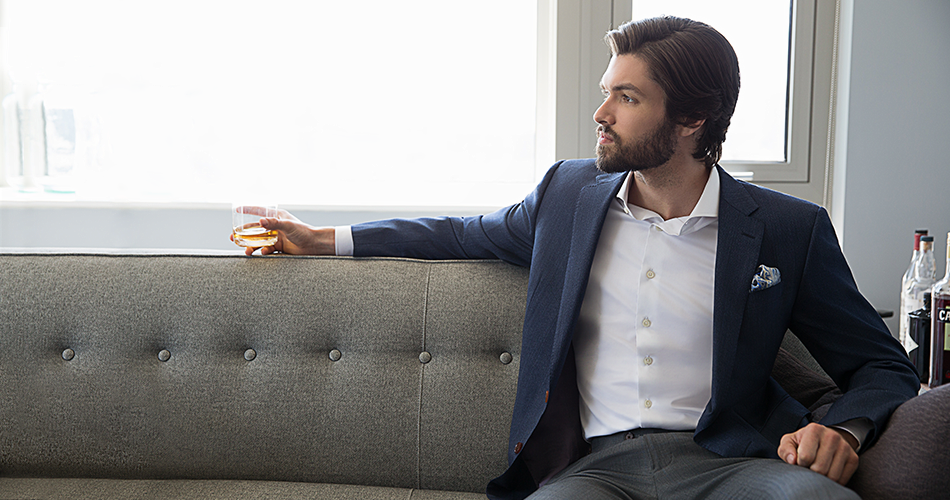 man showing how to keep shirt tucked in on a couch