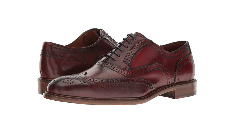 a pair of oxblood brogue wingtip dress shoes