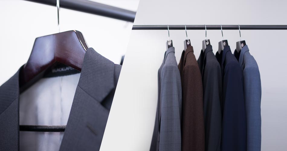 a close up of gray blazer hanging from a wooden hanger next to a zoomed out picture of five suits hanging from a metal rack