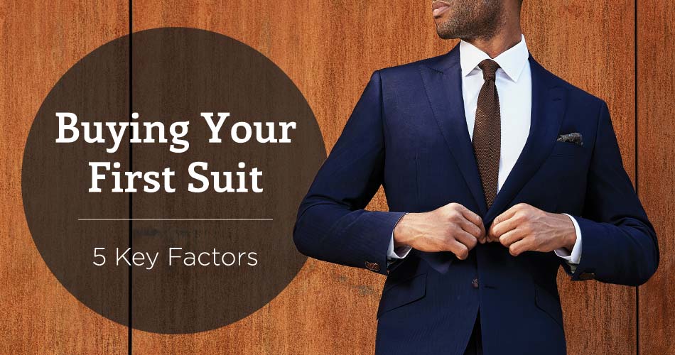 man wearing navy suit with brown tie with black circle overlay with text reading 'buying your first suit, 5 key factors'