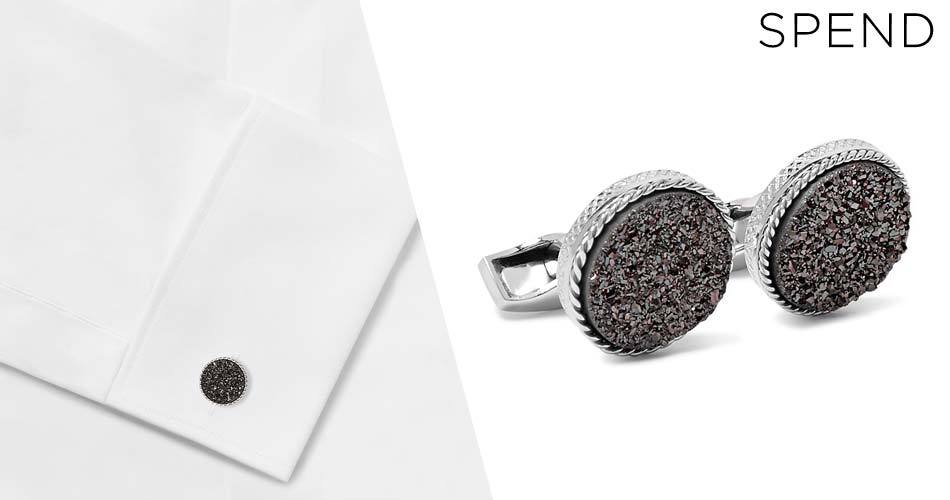 textured silver suit accessory cufflink on white shirt and on white background