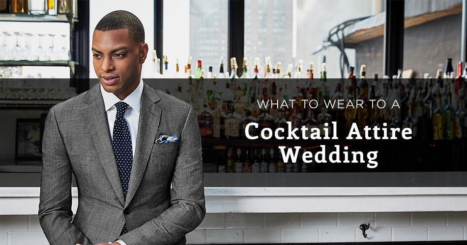 man wearing a gray suit in a bar with text overlay "what to wear to a cocktail attire wedding"