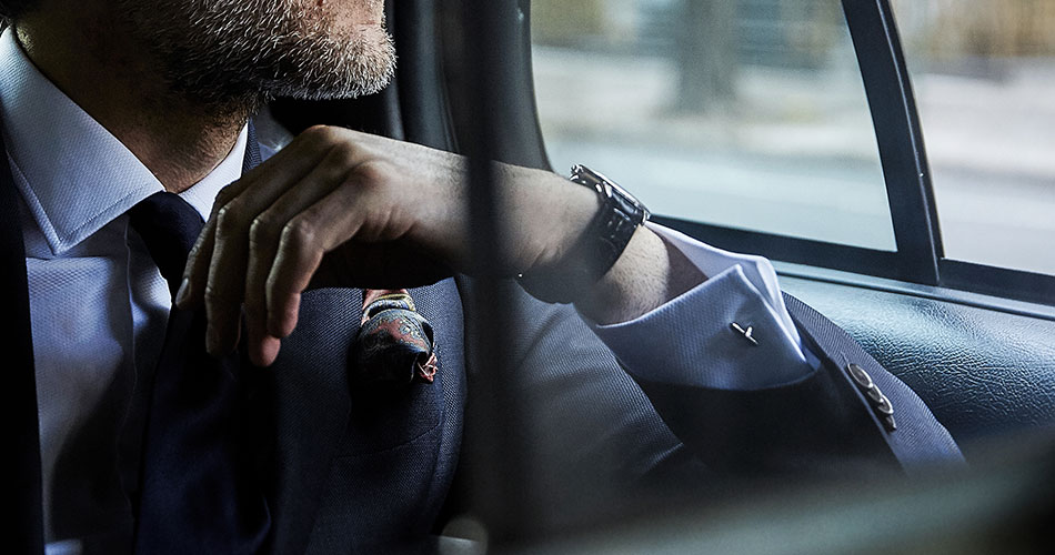 man in a car wearing a french cuff style