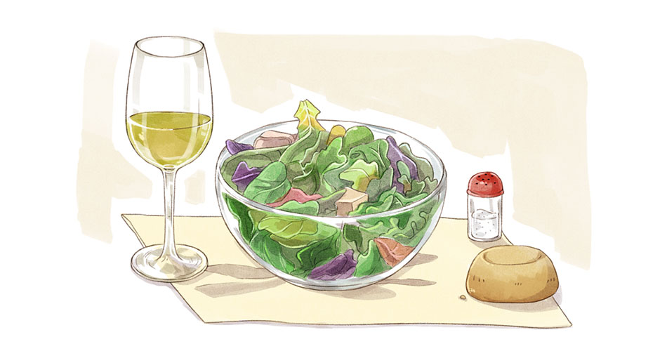 glass of pinot grigio wine for beginners with bowl of salad